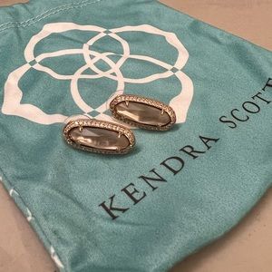 Kendra Scott rose gold earrings.